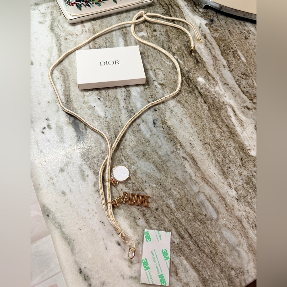 Dior J’adore Phone Strap with Charms. Measures 22” long. New in Box. Sealed